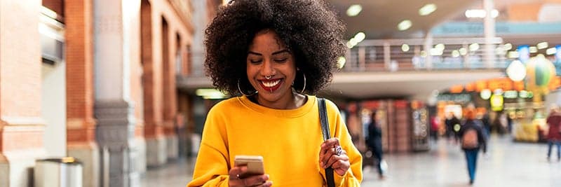 Woman using a smartphone on the move